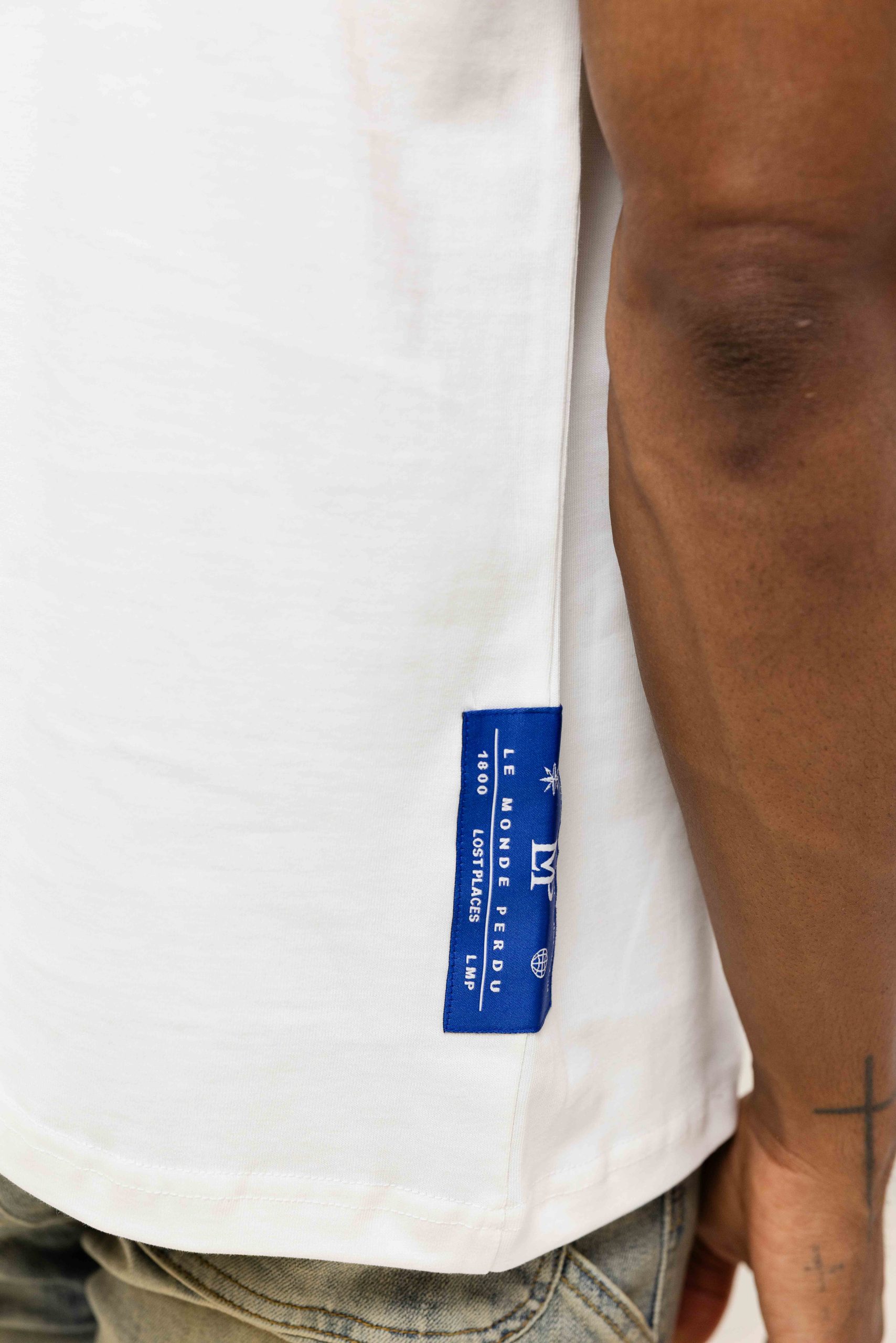 Le Monde Perdu Leaking Logo T-Shirt Heren Gebroken Wit