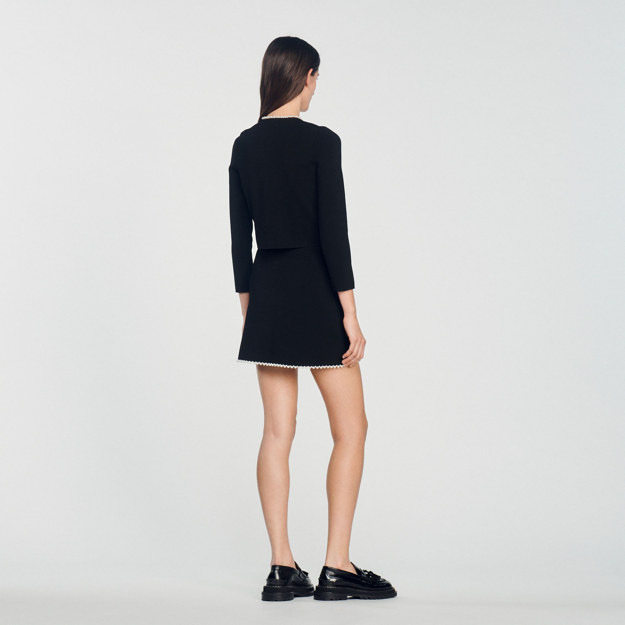 Veste ornee de perles