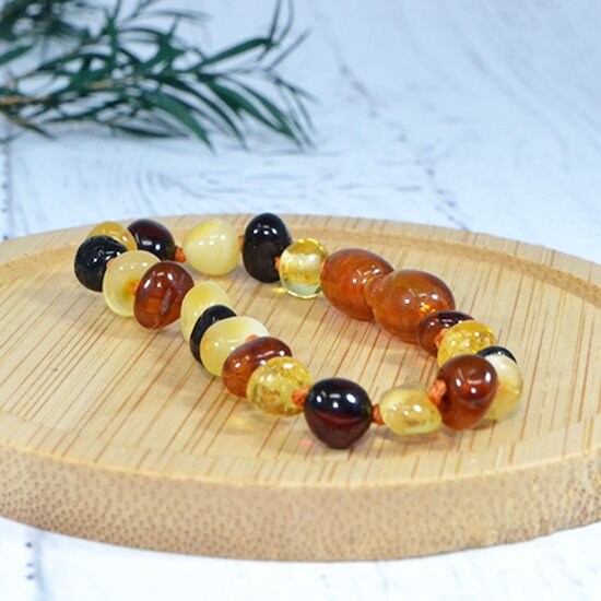Bracelet Ambre bébé   Multi        de               Irréversible