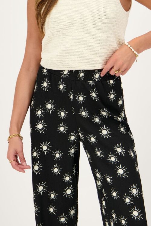 Zwarte crinkle broek met zonnetjes print