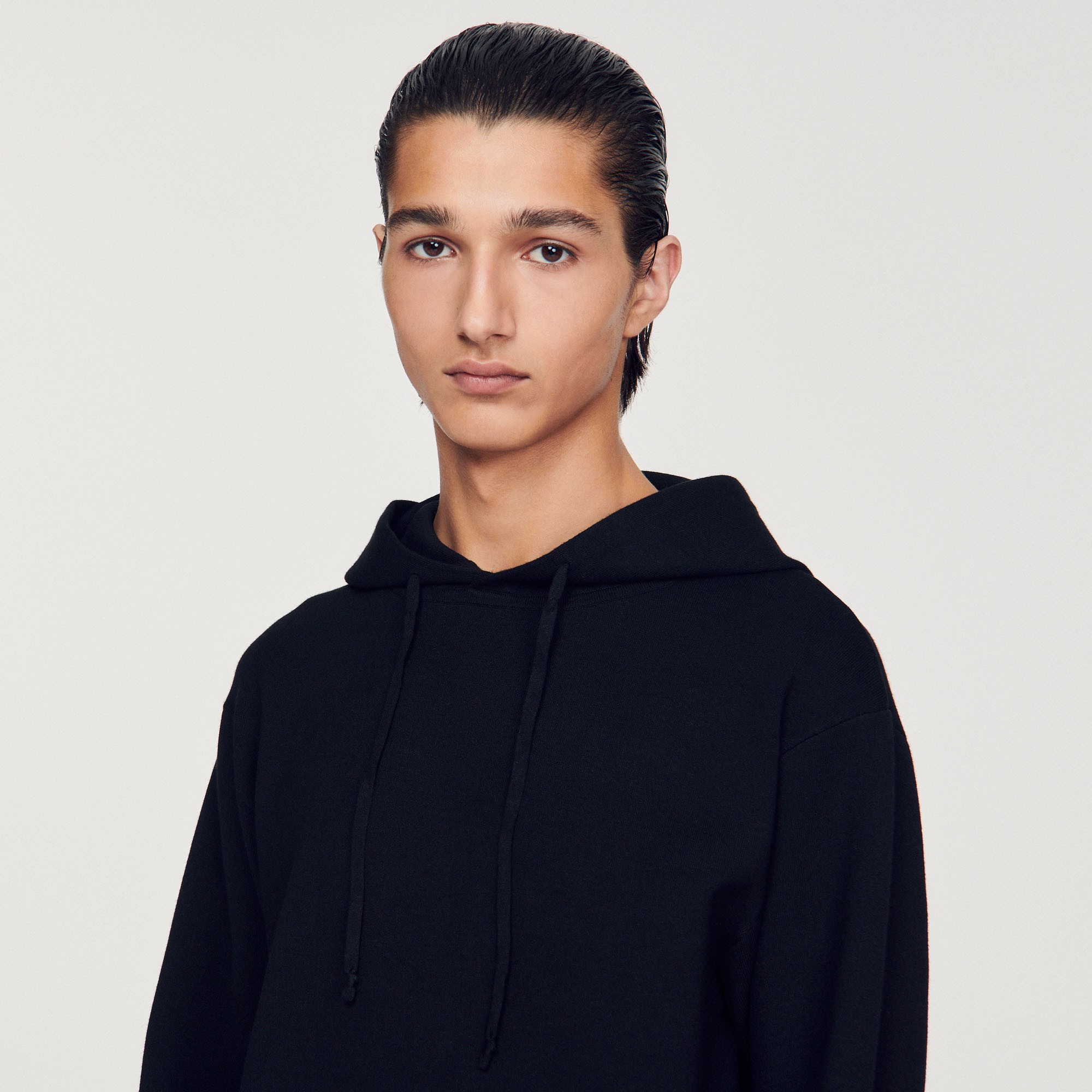 Hoodie en maille tricotee