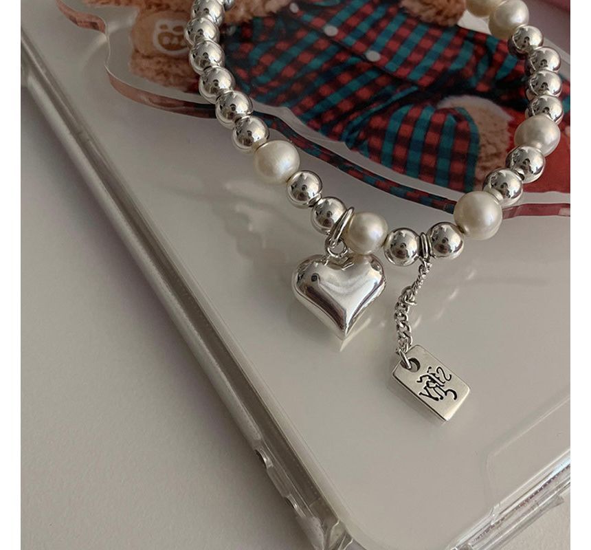Catharsis - Hartvormige armband van imitatieparels