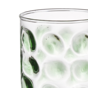 Glas met groene stippen