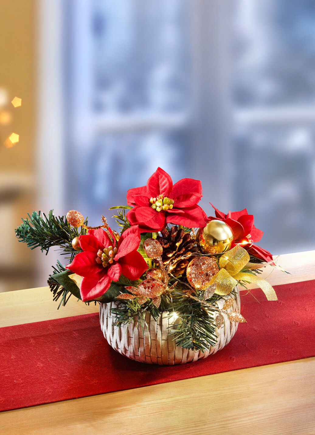 Beleuchtetes Poinsettia-Arrangement