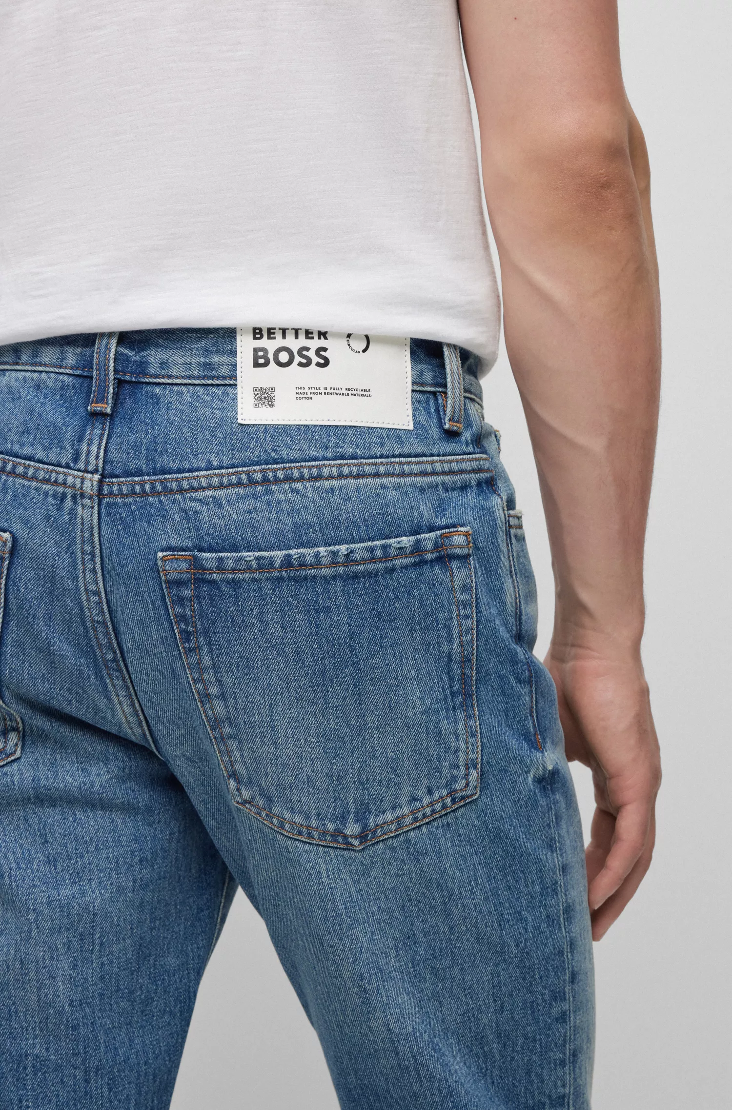 Calça jeans BOSS laranja, corte regular, em denim rígido azul.