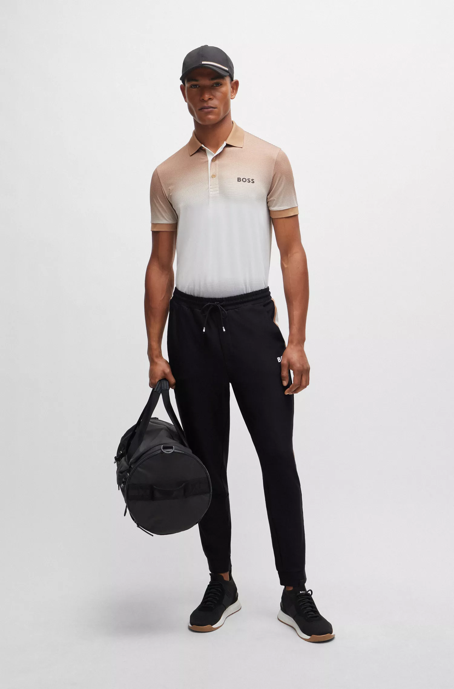 Calça de fato de treino BOSS em jersey elástico verde com fita listrada exclusiva.