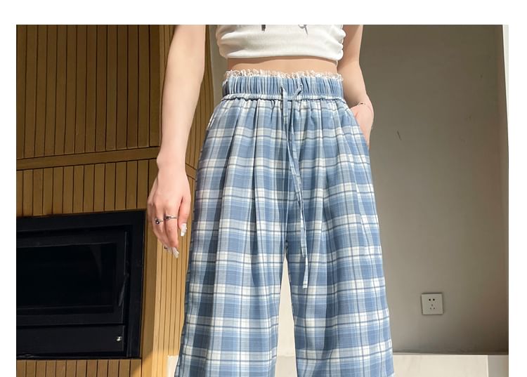 Tel tot 10 - Broek met trekkoord in de taille, geruite kant en wijde pijpen (verschillende ontwerpen)