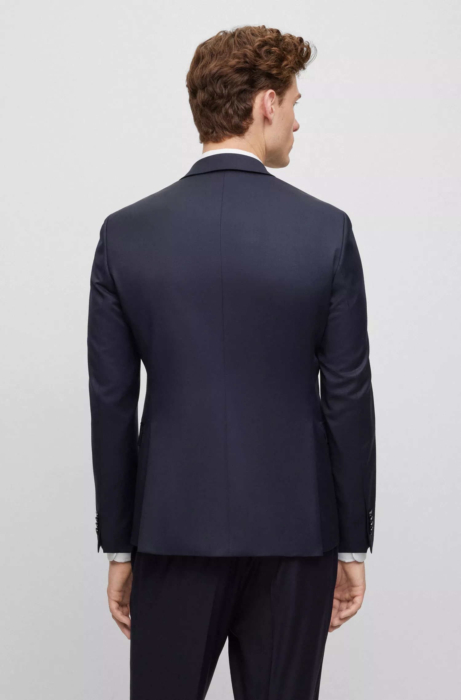 Jaqueta BOSS preta, extra slim fit, em sarja de lã virgem.