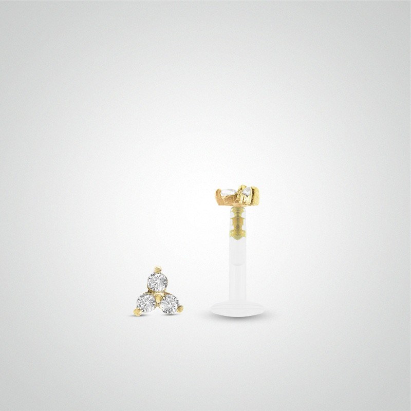 Piercing tragus or jaune avec trois oxydes de zirconium