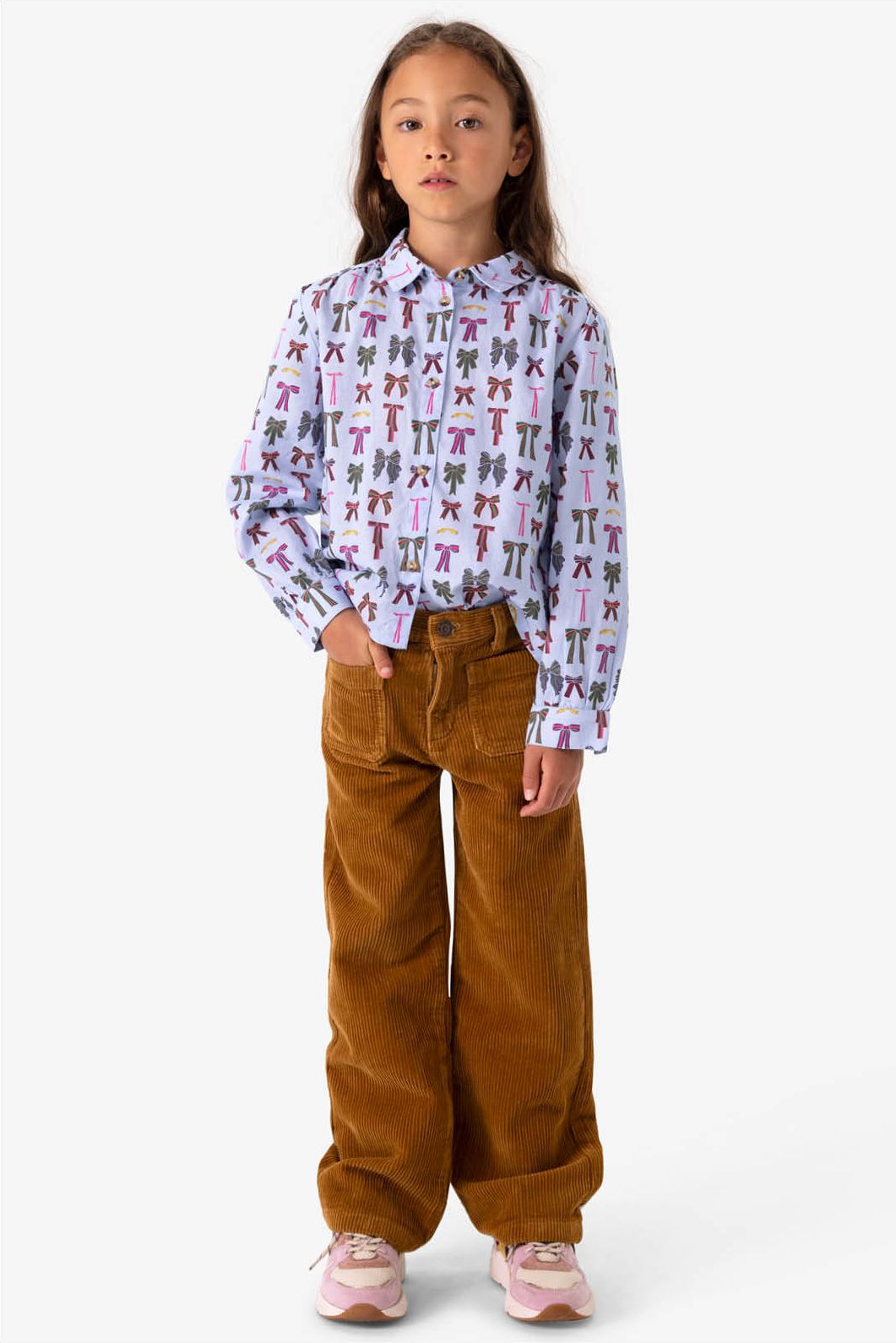 Blauwe blouse met strikkenprint