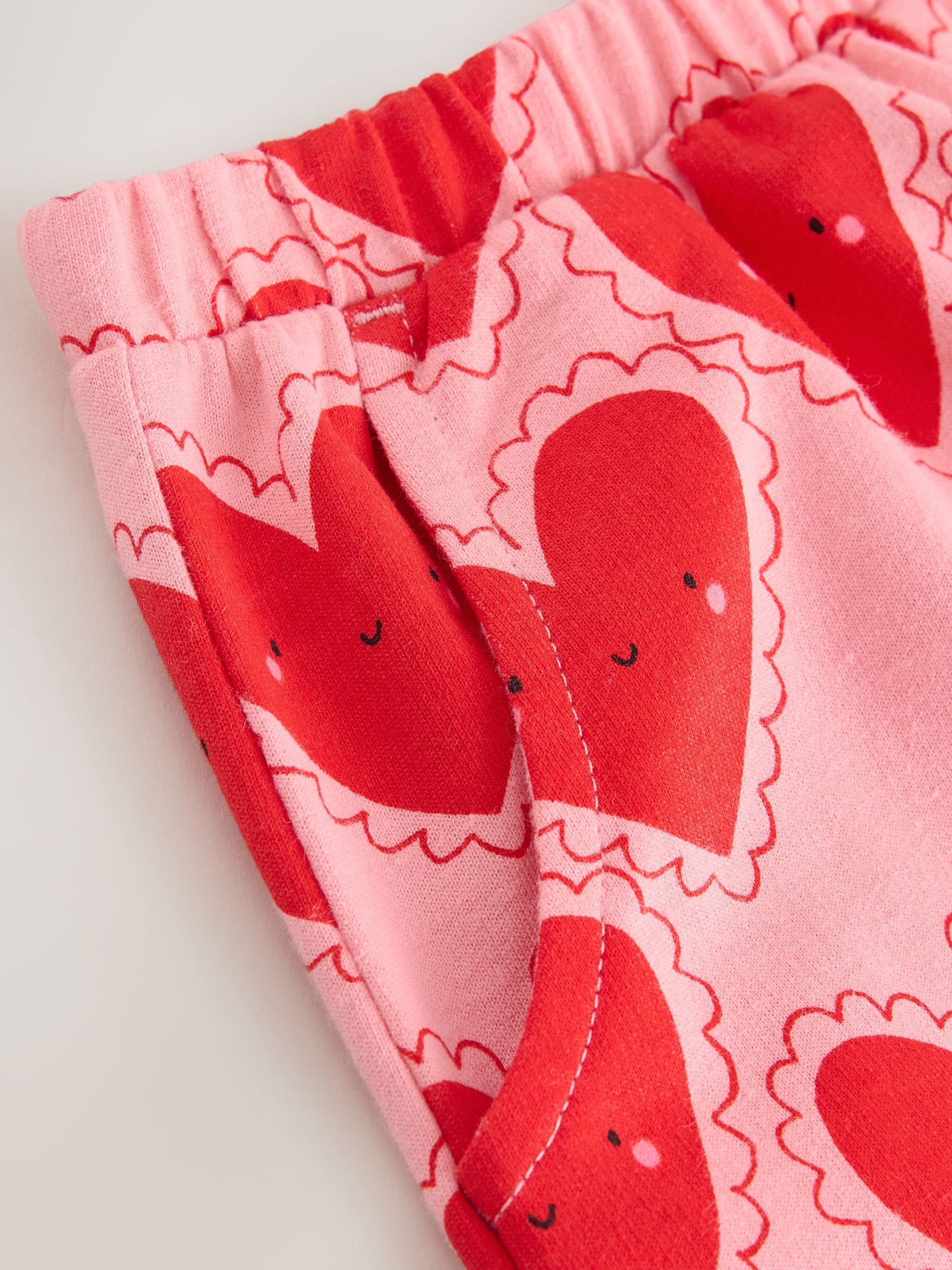 Rood met hartjesprint - Broek met structuur en wijde kortere pijpen (3mnd -7jr)