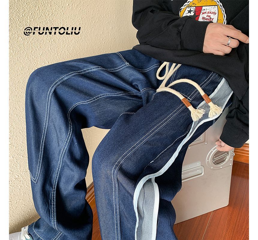 BEAUGALL - Lage taille jeans met contrasterende stiksels en wijde pijpen