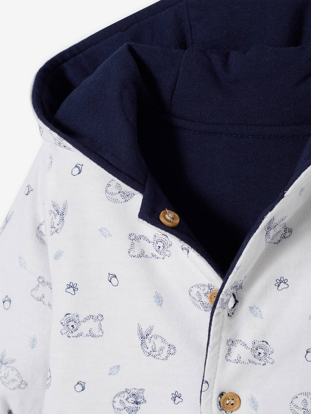 Jaqueta reversível com capuz para bebê, branca lisa com estampas.