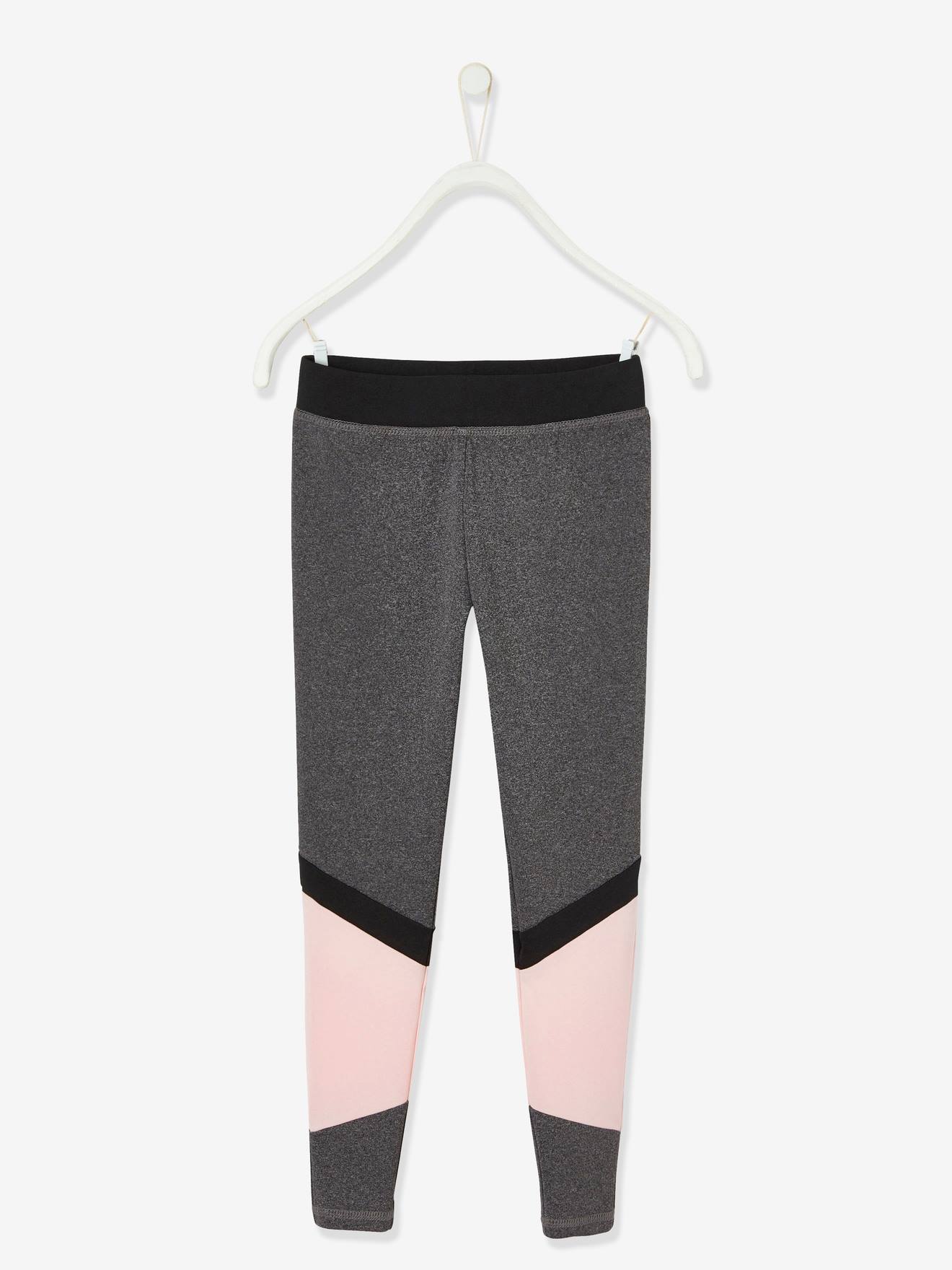 Conjunto esportivo feminino em tecido técnico mesclado cinza escuro, composto por blusa sem mangas e calça legging.
