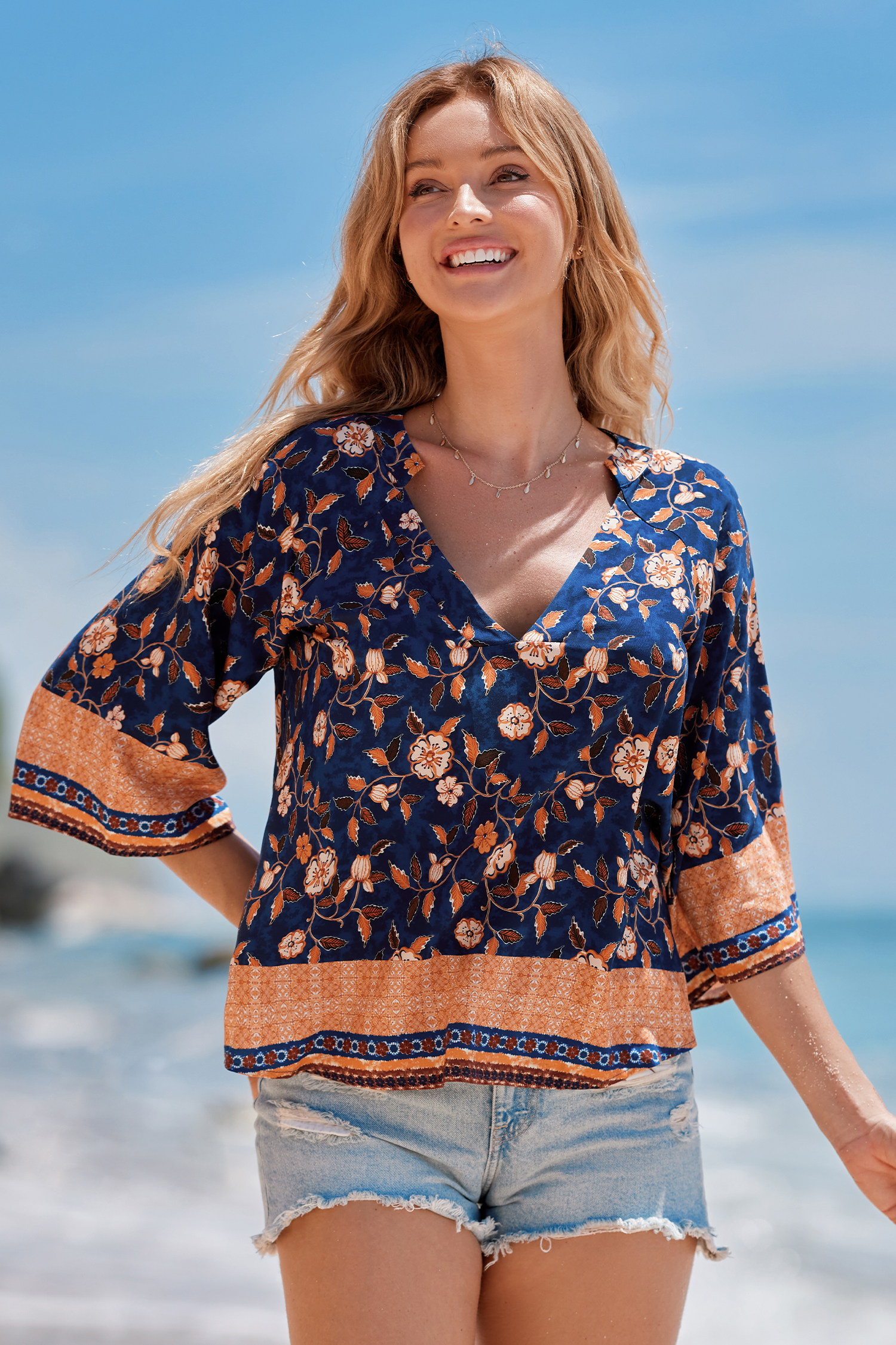 Haut blouson à fleurs bleu et orange