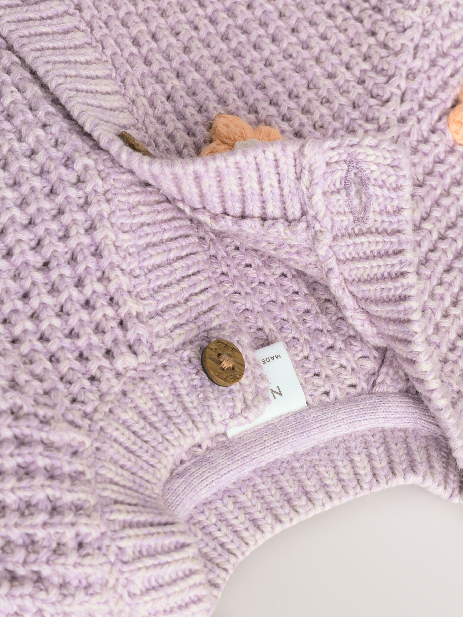 Paarse en abrikozenkleurige bloemen voor baby's - Geborduurd vest (0 mnd - 2 jr)