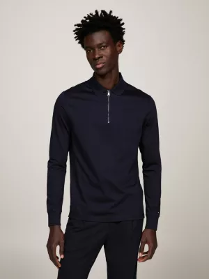 Polo de manga comprida com fecho de correr e corte regular.