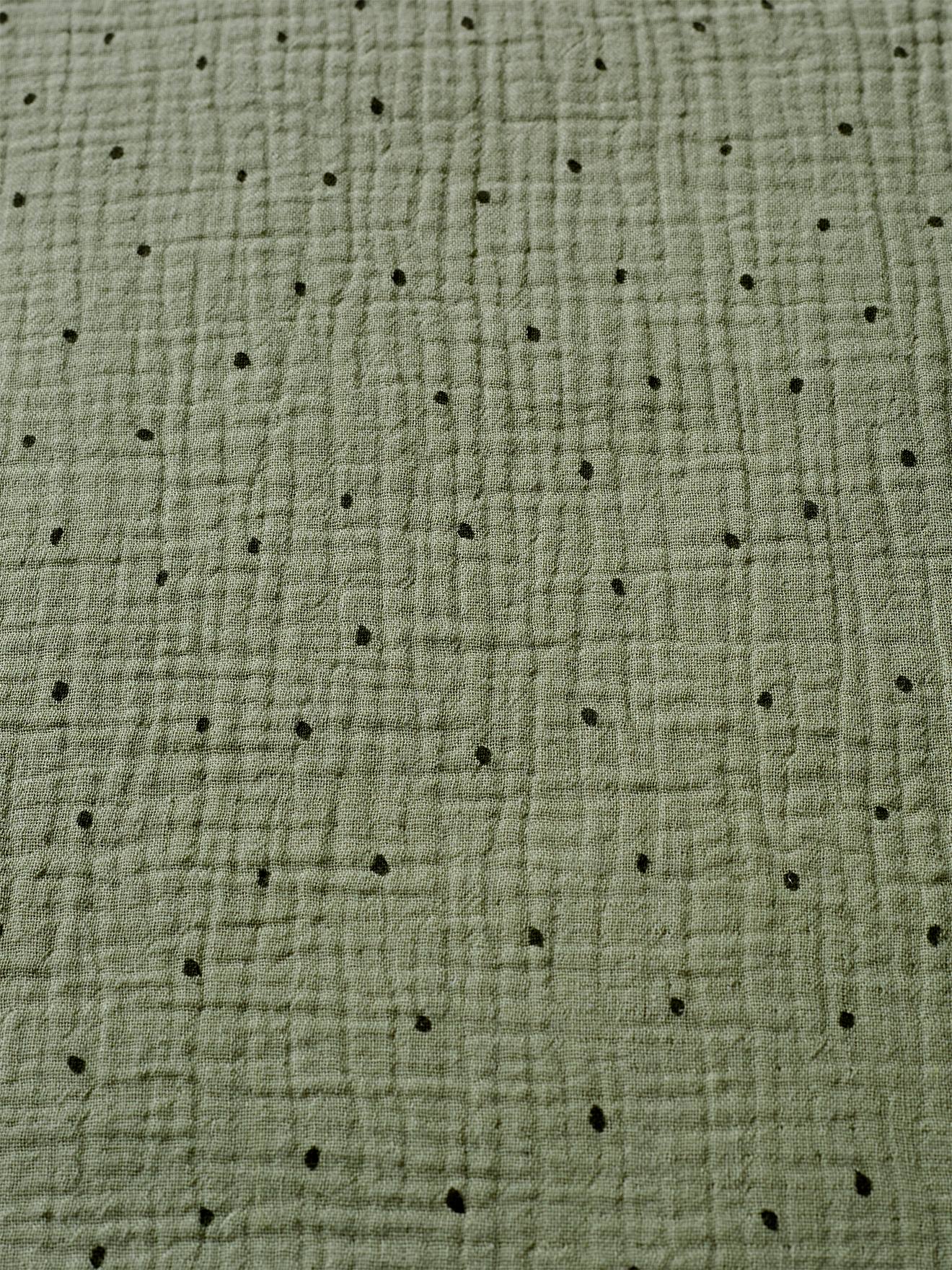 Cardigã sem mangas em chiffon de algodão com estampa lisa de dinossauros em verde médio.