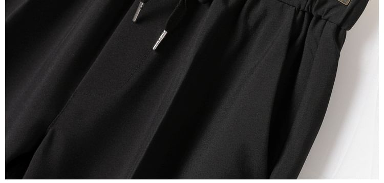 Loansk - Effen cropped, taps toelopende broek met trekkoord in de taille