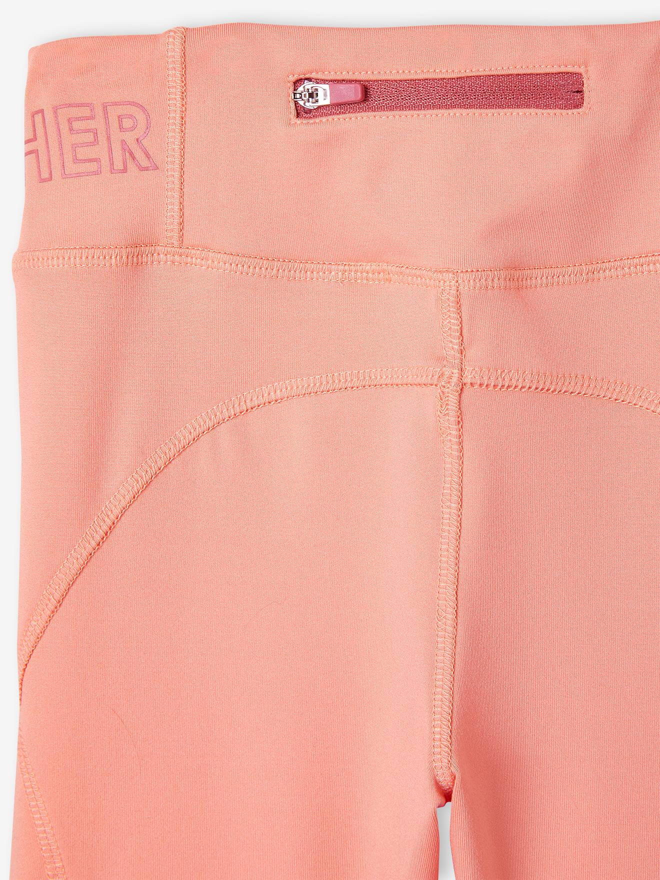 Leggings esportivas femininas em tecido técnico com elástico nos tornozelos, cor damasco.