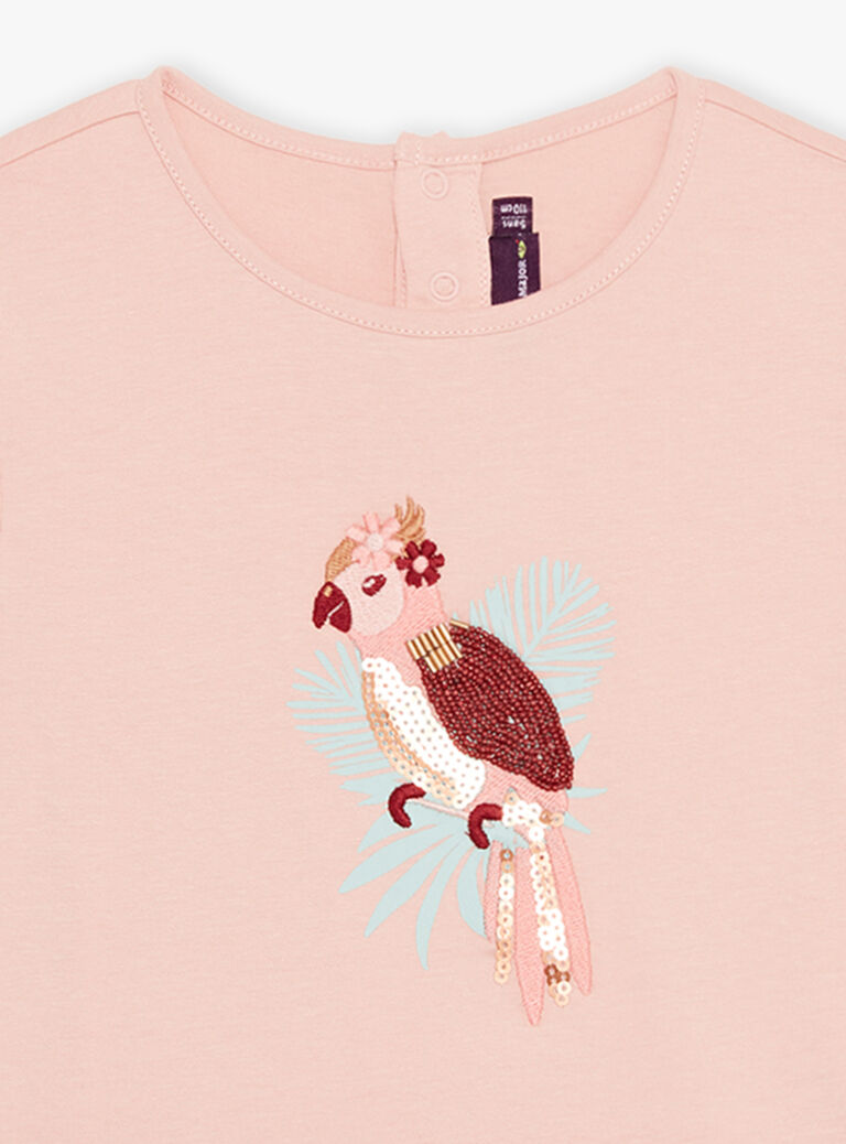 T-shirt rose pâle avec perroquet