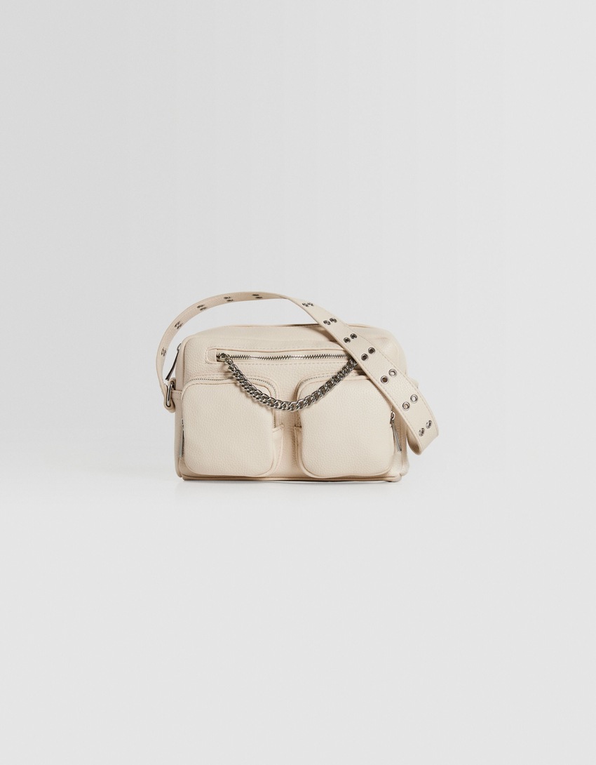 Bolsa transversal multifuncional com corrente e bolsos.
