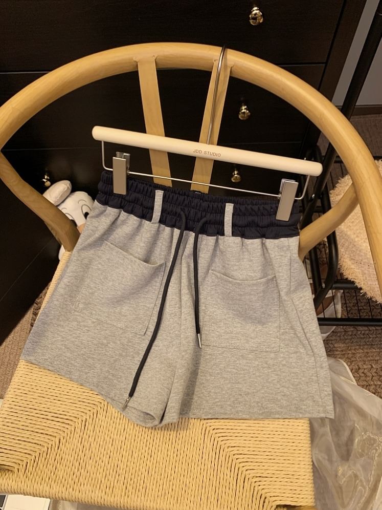 Mikiko - Tweekleurige joggingbroek met trekkoord in de taille