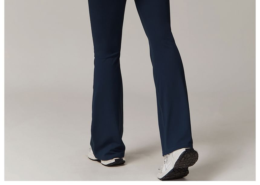 Skinniano - Spaghettibandjes, contrasterende afwerking en open rug, bootcut sportjumpsuit