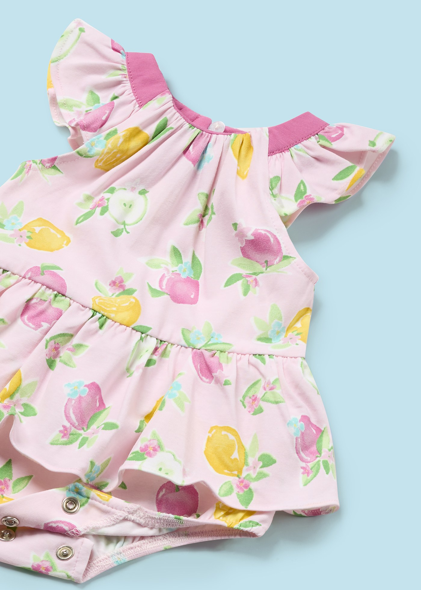 Macacão Better Cotton Juicy para recém-nascido com faixa de cabeça e estampa de frutas.