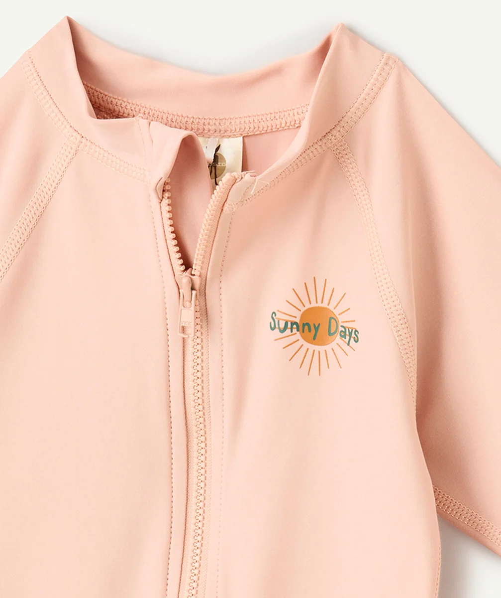 LASSIGCOMBINAISON ANTI-UV BÉBÉ FILLE ROSE AVEC MOTIF SOLEIL
