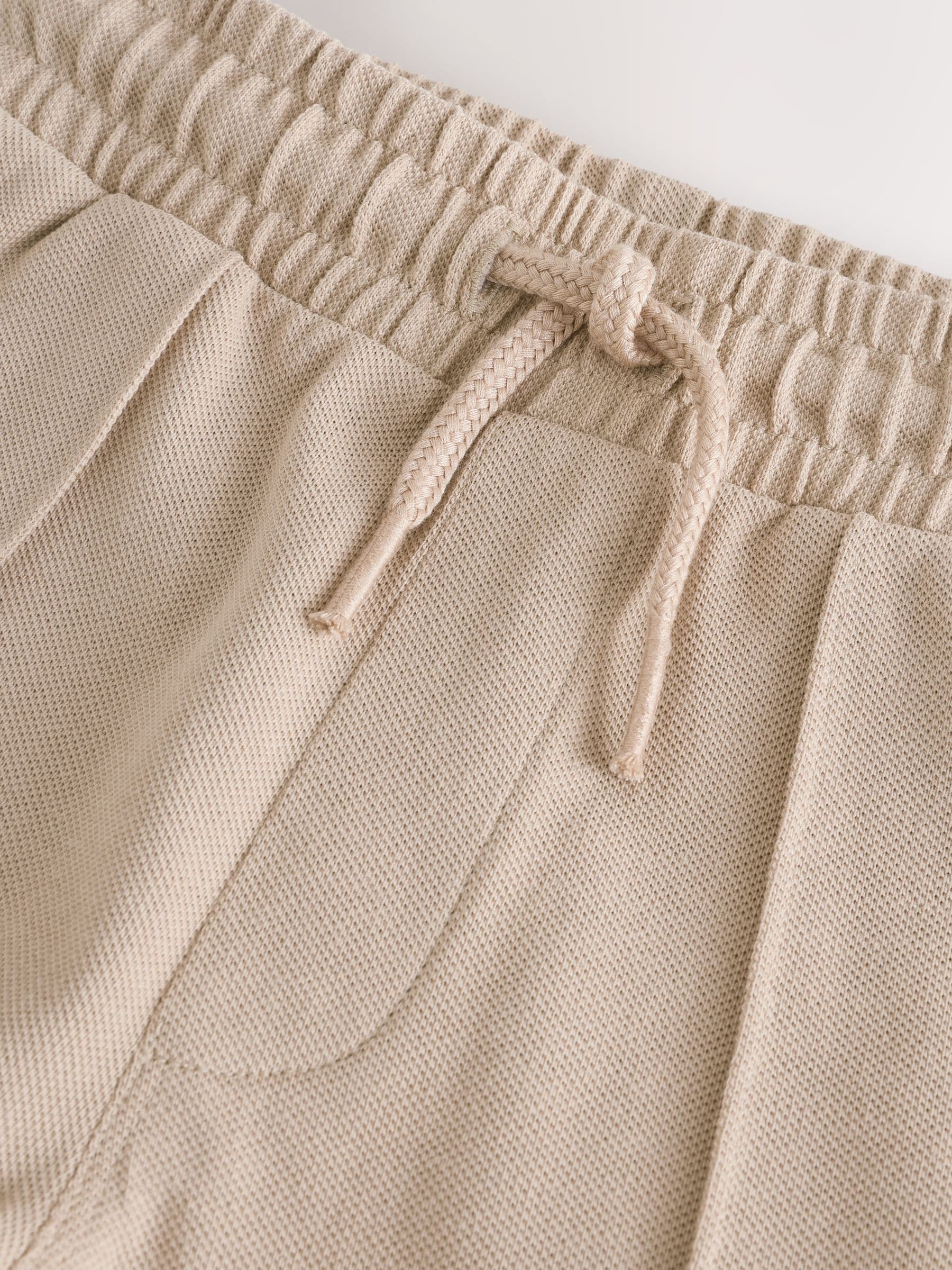 Pastelgeel - Pintuck joggingbroek van 100% katoen (3mnds-7jr)