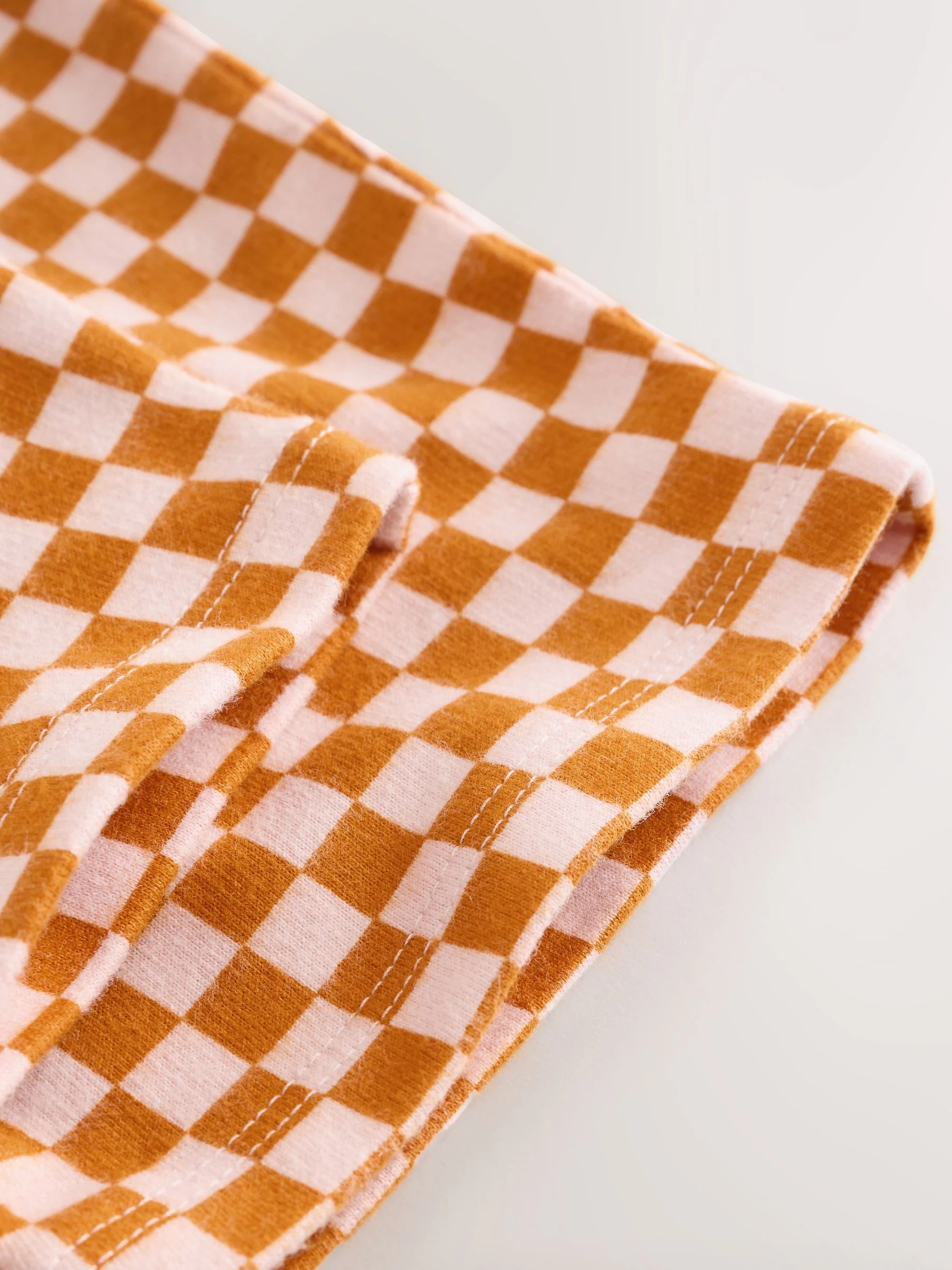 Oranje met dambordmotief - Broek met wijde kortere pijpen (3mnd -7jr)
