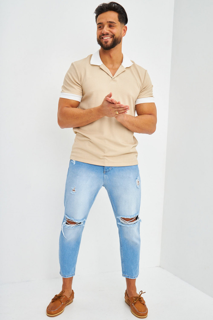 Polo beige à détails blanc