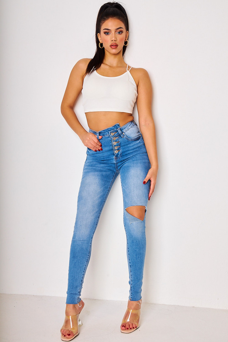 Jeans bleu skinny découpé à boutons