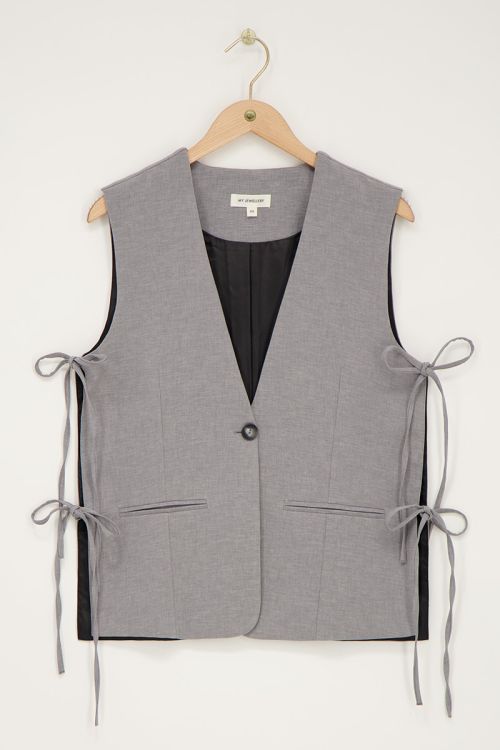 Grijs gilet met strikjes aan de zijkant