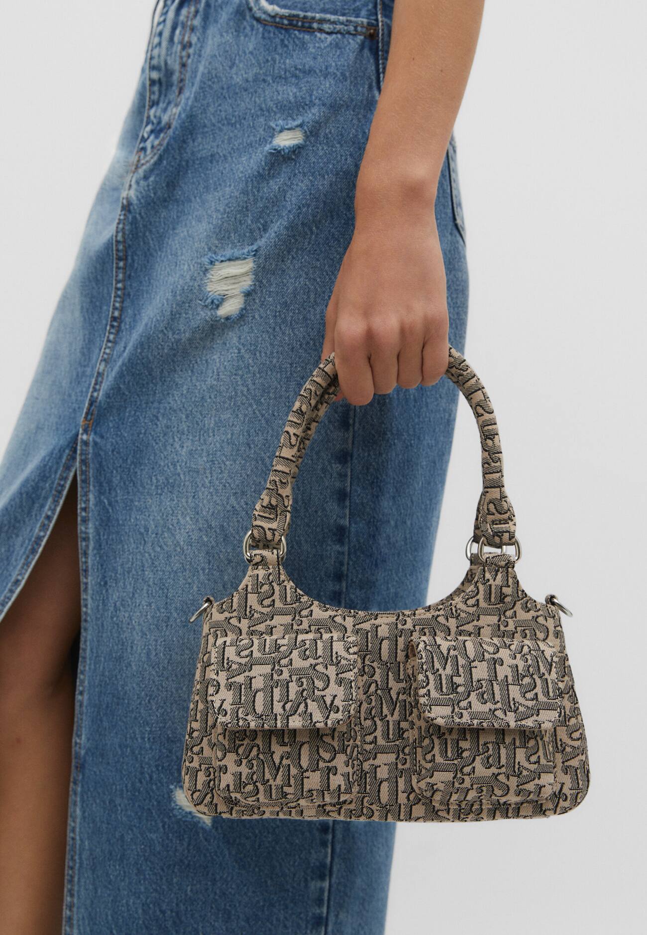 Bolsa de ombro com bolsos