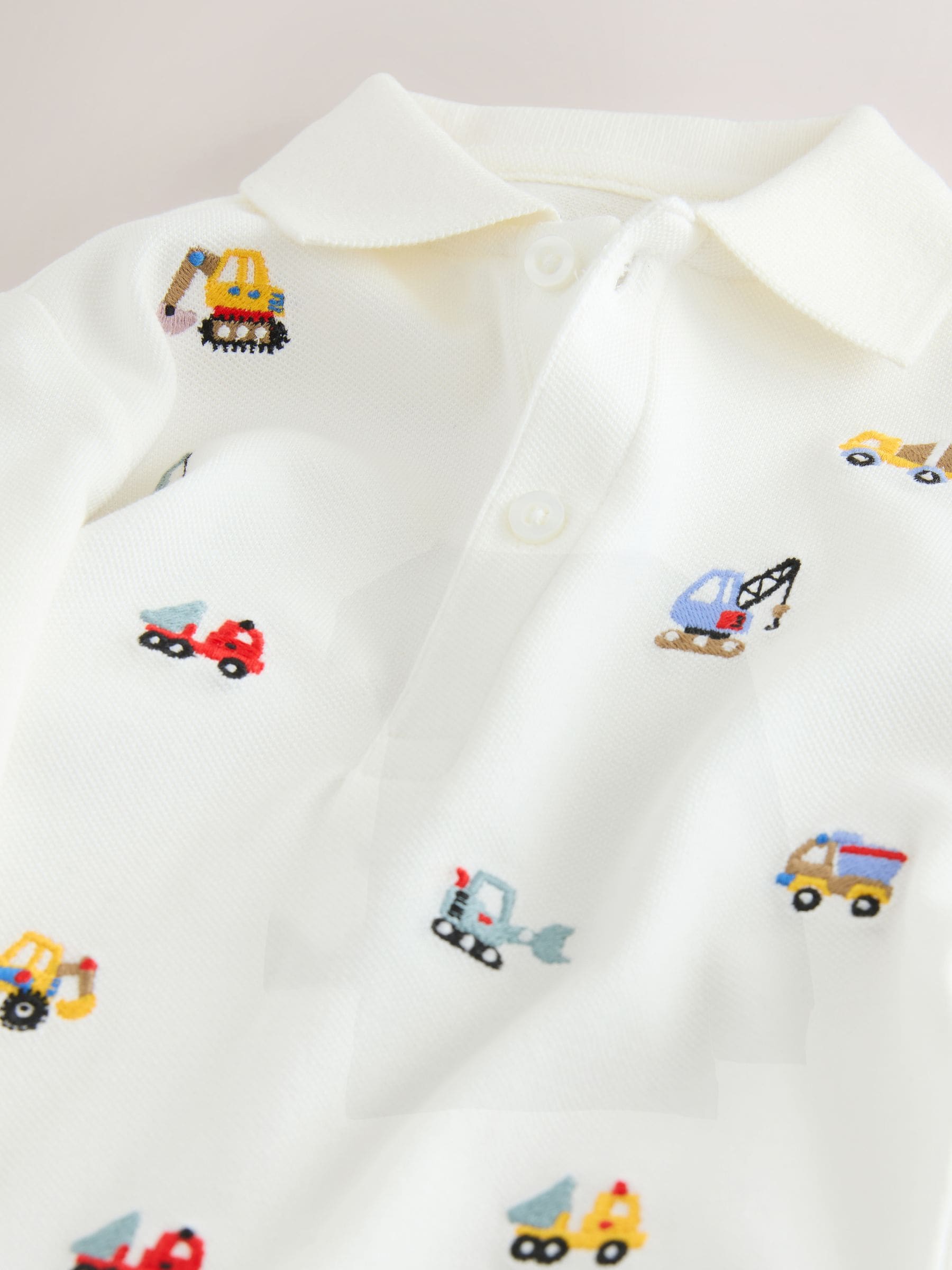 Wit graafmachine - Poloshirt met all-over borduursel en lange mouwen (3mnd-7jr)