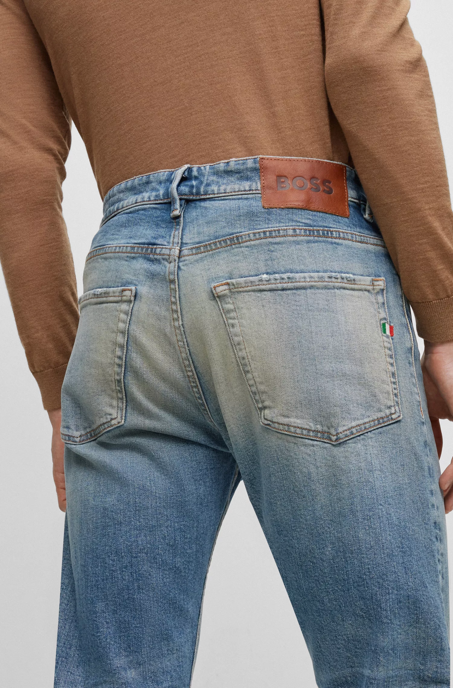 Calça jeans BOSS laranja, corte afunilado, em denim italiano selvedge azul.
