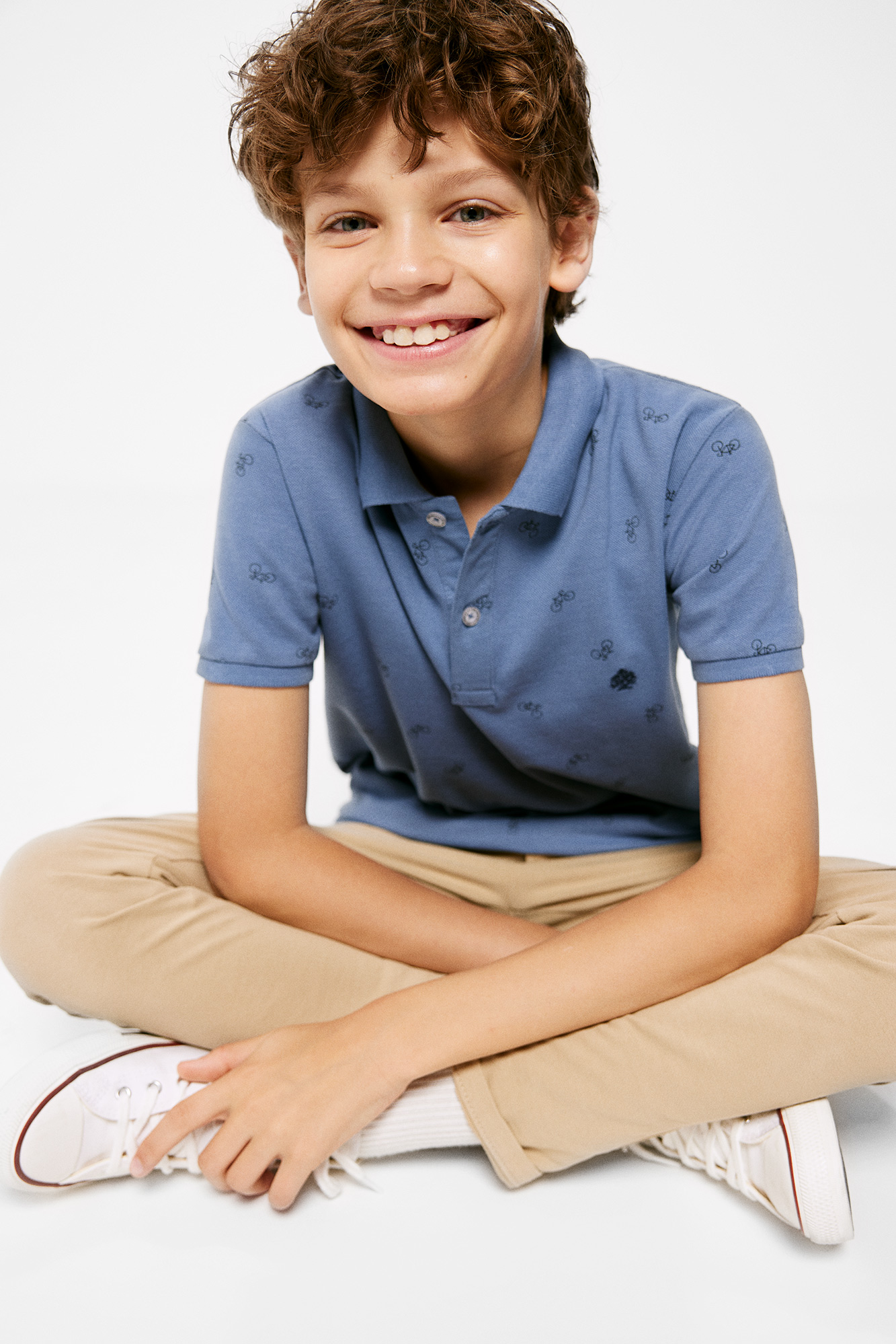 Camisa polo infantil com estampa de bicicleta