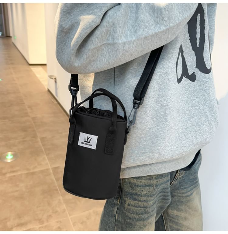 Hikuozy - Crossbodytas met trekkoord en letters