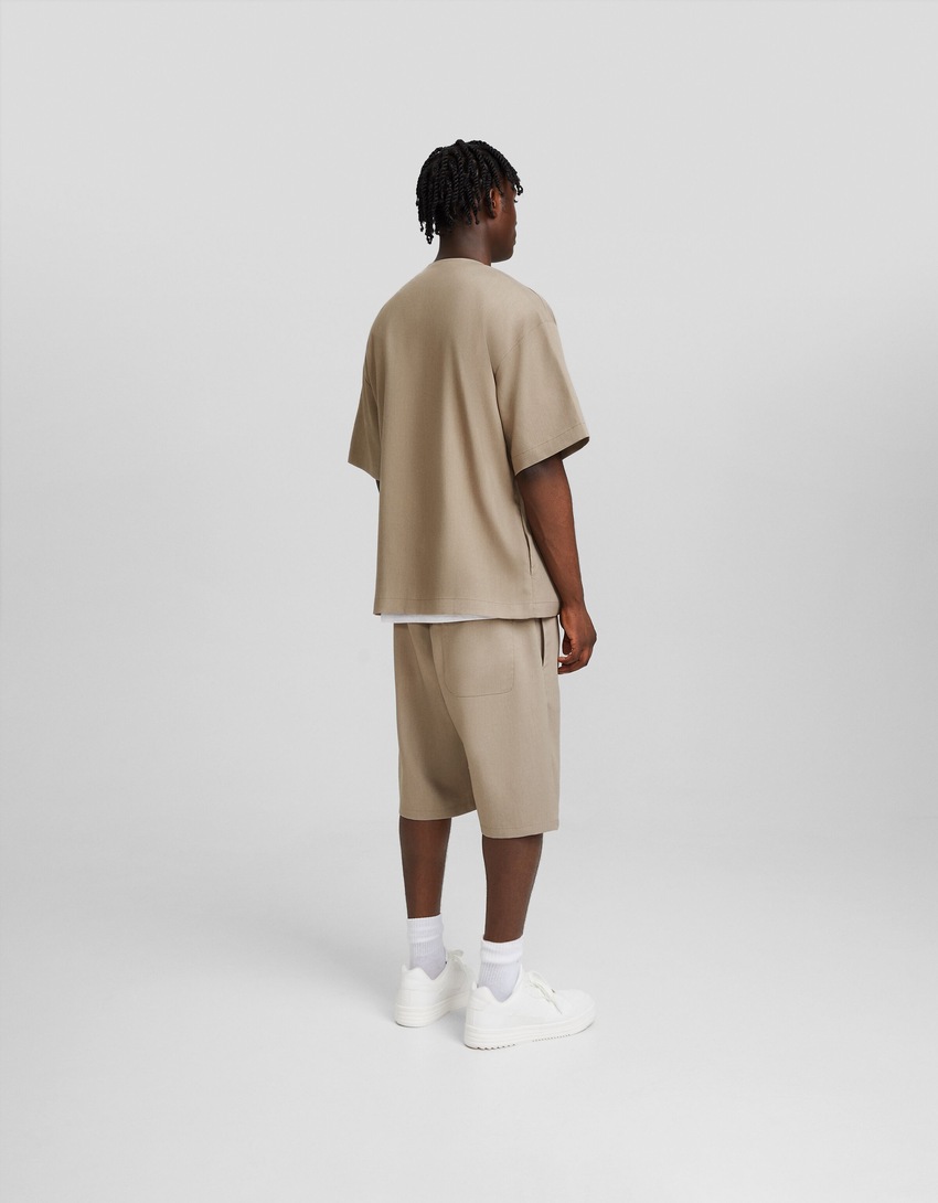 Bermudas de alfaiataria com pernas largas