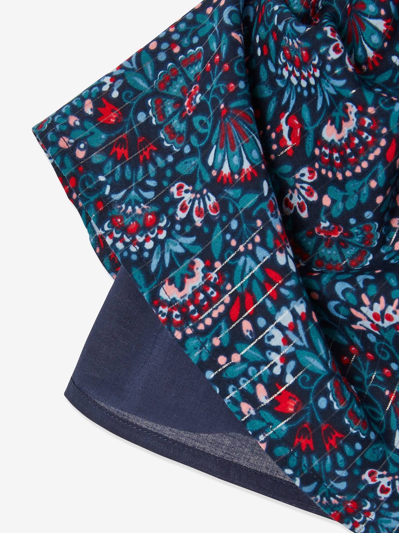 Saia estampada floral com detalhes em fios brilhantes, estampa azul vibrante para menina.