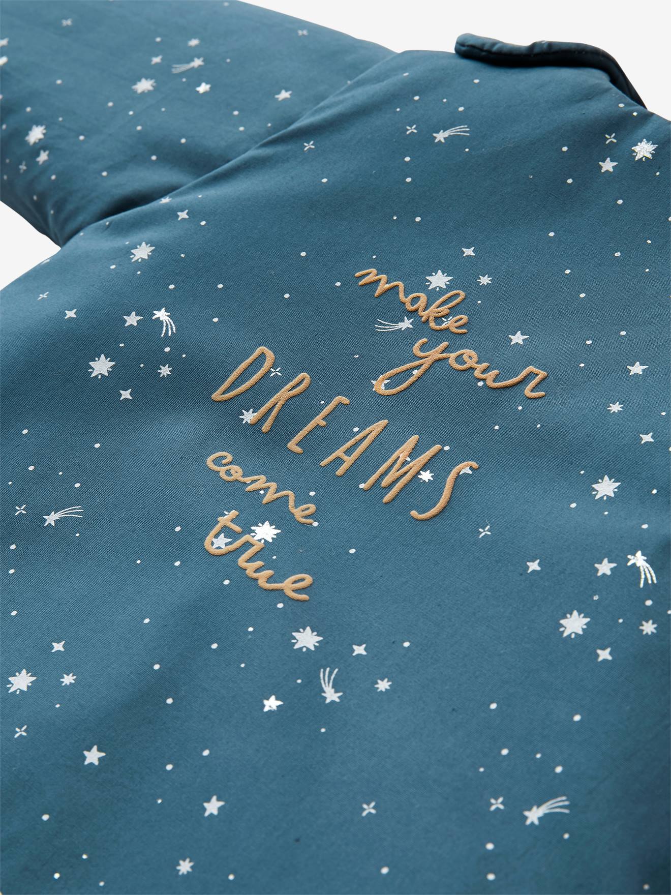 Saco de dormir liso azul escuro com estampa de urso polar e mangas removíveis.