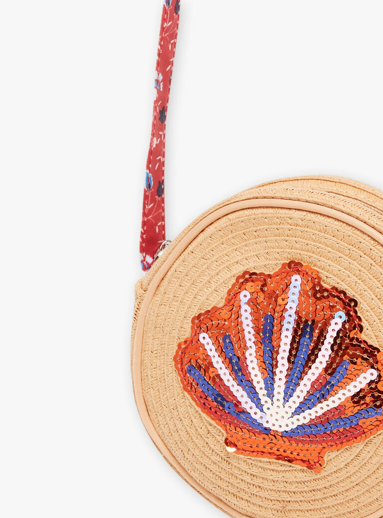 Sac rond en paille beige avec coquillage en sequin rouge