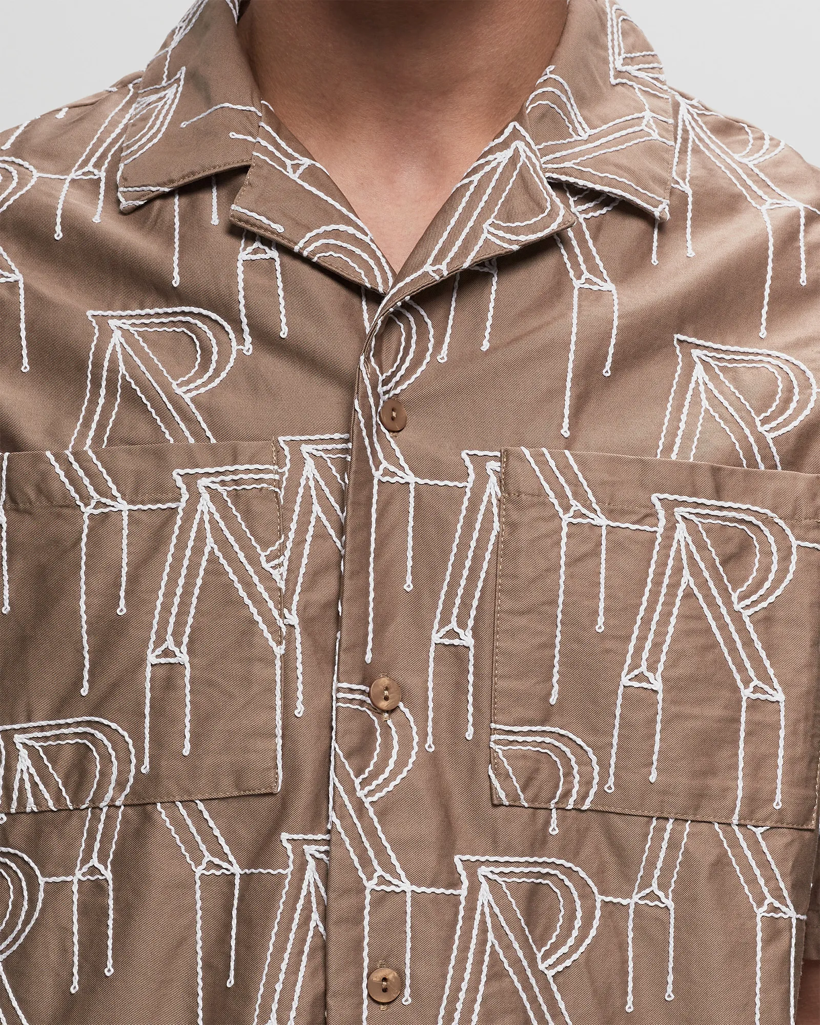 Represent EMBRODIERED INITIAL OVERSHIRT