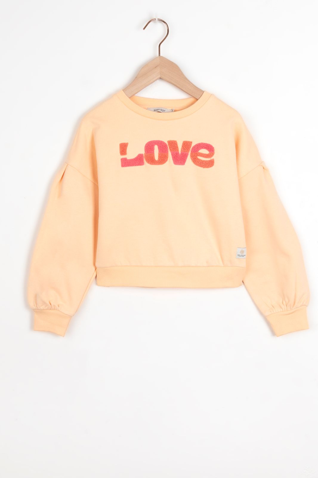 Pastel oranje sweater met badstof print