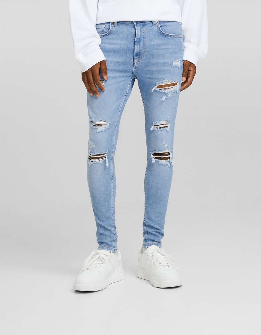 calça jeans super skinny rasgada