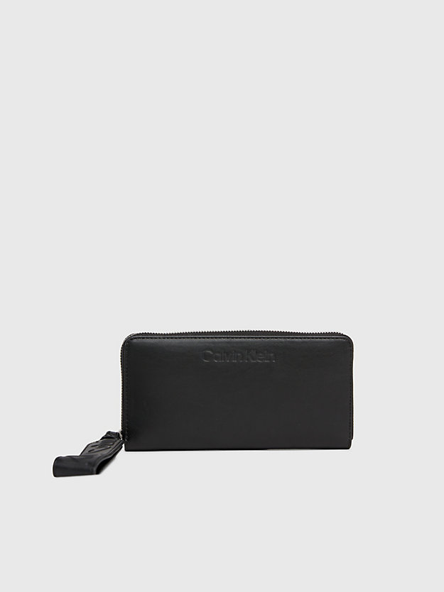 Carteira com zíper completo e porta-moedas de pulso com proteção RFID.