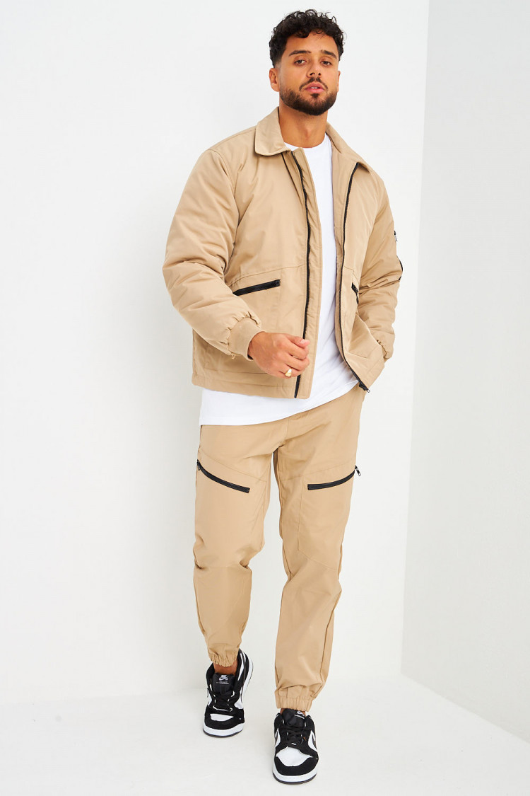 Blouson beige foncé à poches zippées