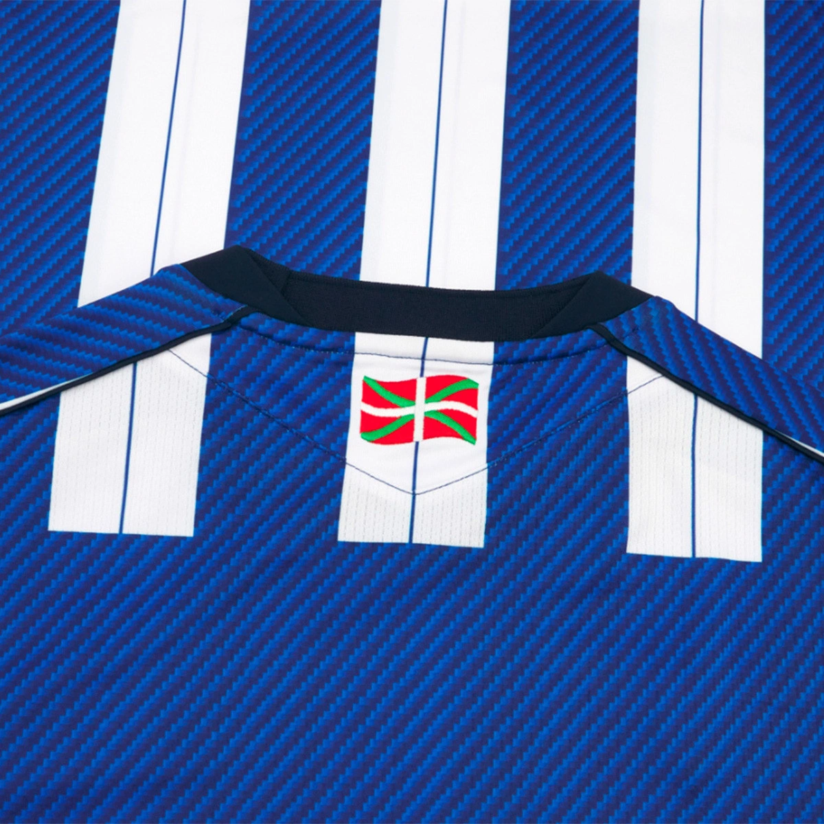 Camisola Macron Real Sociedad Primeiro Equipamento 2025-2026 Criança